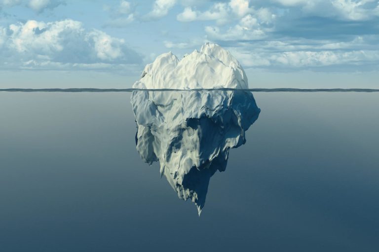Iceberg at sea with underside visible